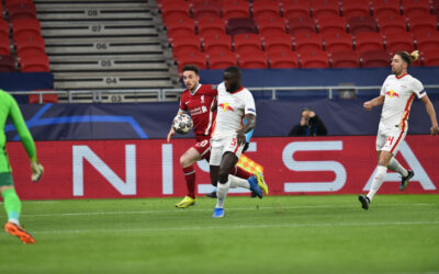 Liverpool's Diogo Jota (L) and RB Leipzig's Dayot Upamecano during the UEFA Champions League Round of 16 2nd Leg game between Liverpool FC and RB Leipzig at the Puskás Aréna