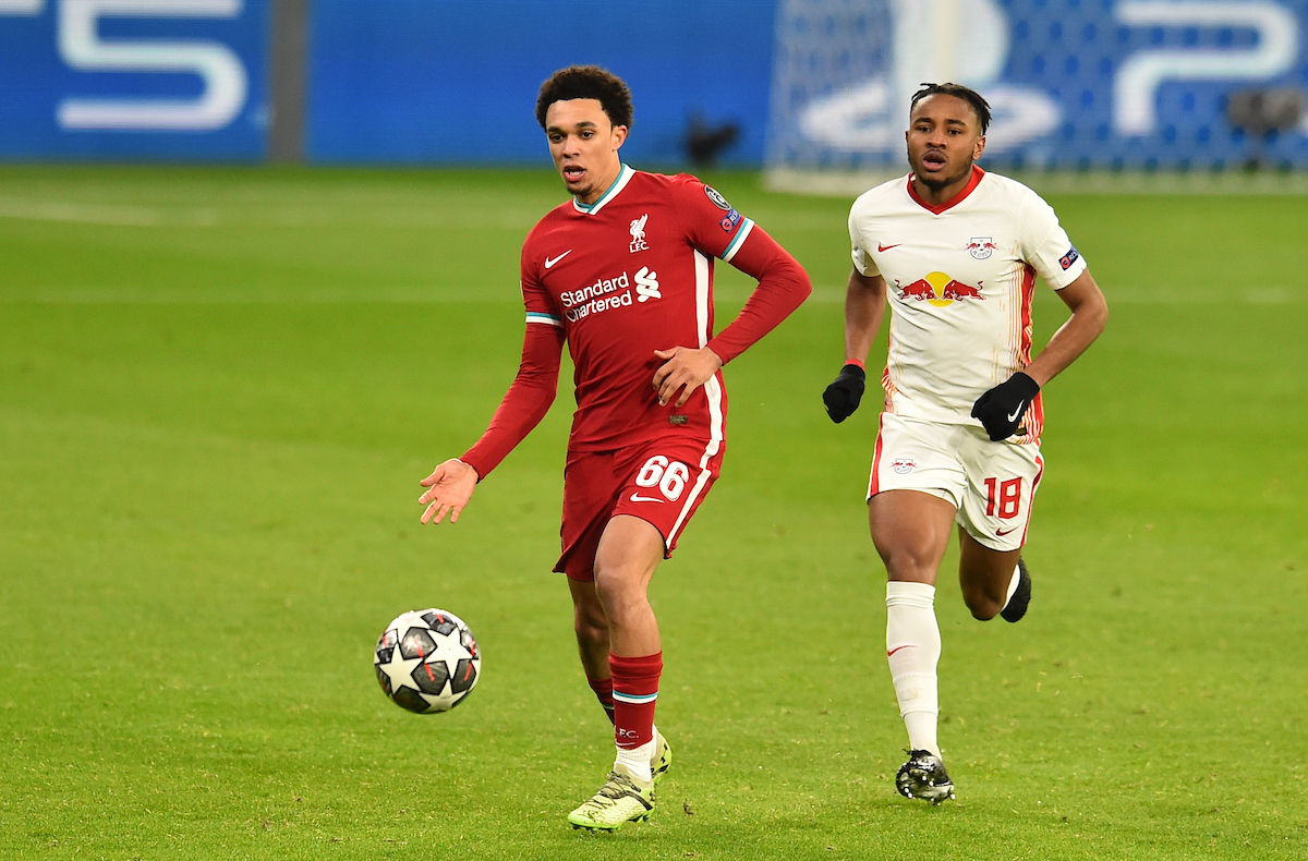 Liverpool's Trent Alexander-Arnold (L) and RB Leipzig's Christopher Nkunku during the UEFA Champions League Round of 16 2nd Leg game between Liverpool FC and RB Leipzig at the Puskás Aréna