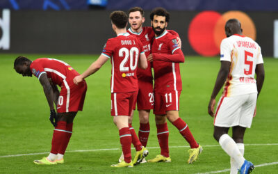 Liverpool's Mohamed Salah (R) celebrates after scoring the first goal during the UEFA Champions League Round of 16 2nd Leg game between Liverpool FC and RB Leipzig at the Puskás Aréna