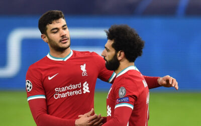 Liverpool's Ozan Kabak celebrates with Mohamed Salah during the UEFA Champions League Round of 16 second Leg game between Liverpool FC and RB Leipzig at the Puskás Aréna