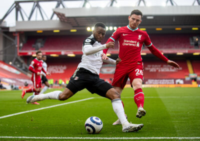 Fulham's Ademola Lookman (L) and Liverpool's Andy Robertson during the FA Premier League match between Liverpool FC and Fulham FC at Anfield