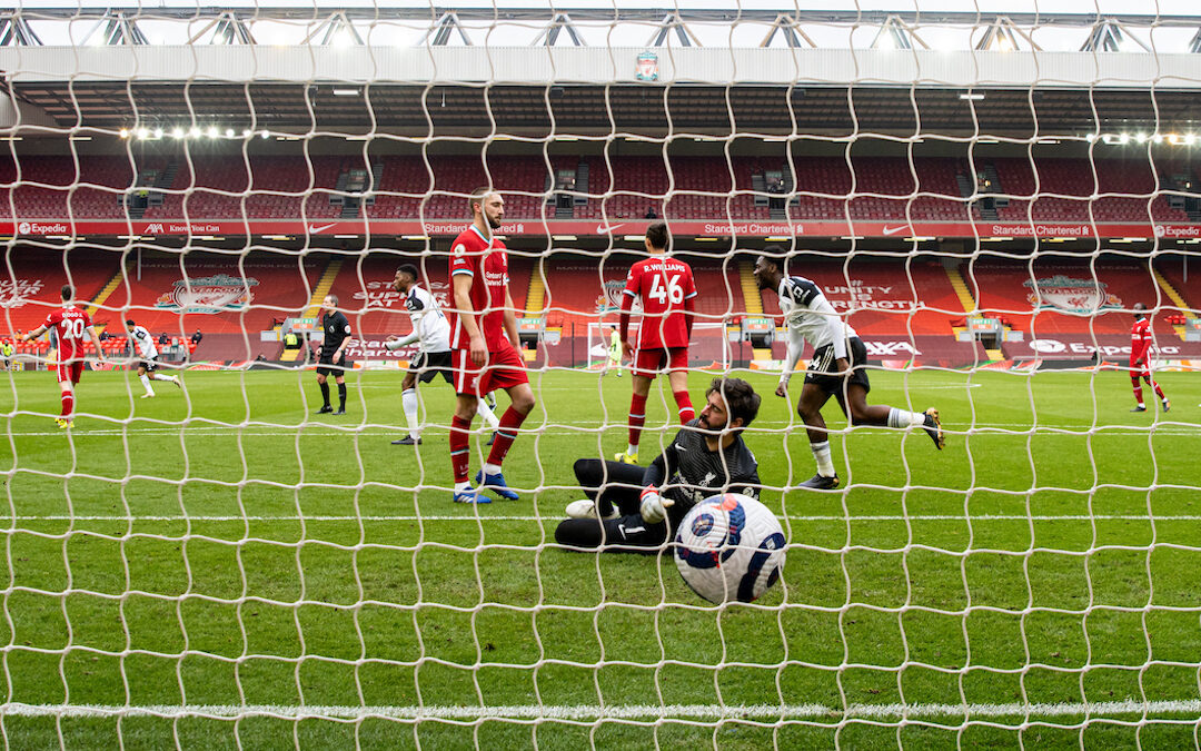 Liverpool's goalkeeper Alisson Becker looks dejected as Fulham score the opening goal during the FA Premier League match between Liverpool FC and Fulham FC at Anfield