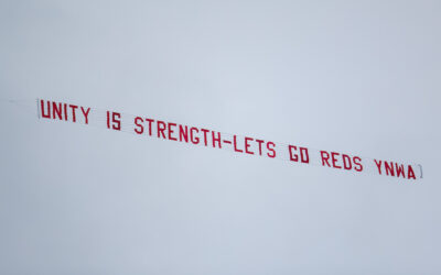 A plane banner flies over Anfield with the message "Unityt is strength - Lets (sic) go Reds YNWA" during the FA Premier League match between Liverpool FC and Fulham FC at Anfield