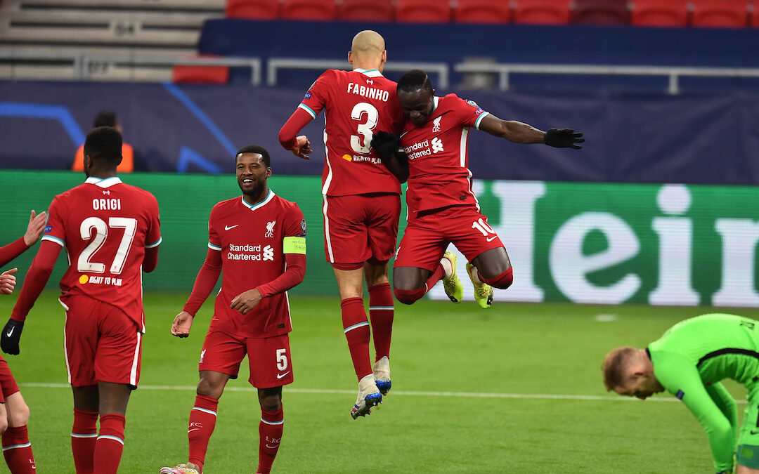 Liverpool's Sadio Mané (R) celebrates with team-mate Fabio Henrique Tavares 'Fabinho' after scoring the second goal during the UEFA Champions League Round of 16 2nd Leg game between Liverpool FC and RB Leipzig at the Puskás Aréna