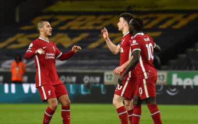 Liverpool's Diogo Jota celebrates with Thiago Alcantara and Sadio Mane after scoring the first goal during the Premier League match between Wolves and Liverpool FC at Molineux Stadium