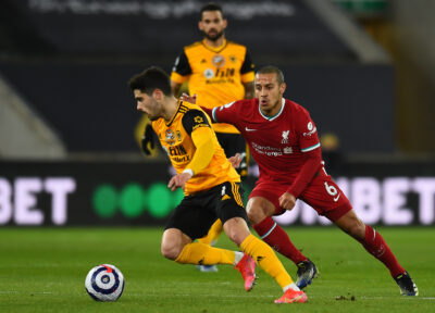 Pedro Neto and Thiago Alcantara during the Premier League match between Wolves and Liverpool FC at Molineux Stadium
