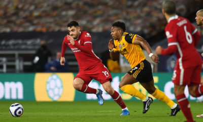 Ozan Kabak and Adama Traore during the Premier League match between Wolves and Liverpool FC at Molineux Stadium