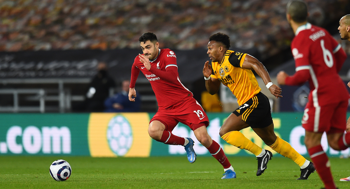 Ozan Kabak and Adama Traore during the Premier League match between Wolves and Liverpool FC at Molineux Stadium