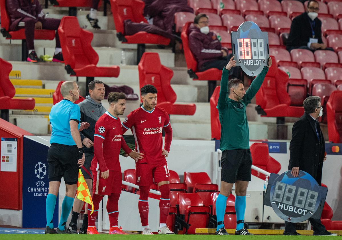 Wednesday, April 14, 2021: Liverpool's substitutes Xherdan Shaqiri (L) and Alex Oxlade-Chamberlain prepare to come on during the UEFA Champions League Quarter-Final 2nd Leg game between Liverpool FC and Real Madrid CF at Anfield. The game ended in a goal-less draw, Real Madrid won 3-1 on aggregate.