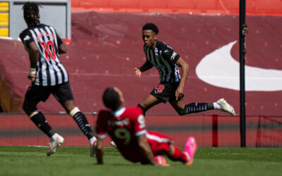 Newcastle United's Joe Willock celebrates after scoring an equalising goal in the 95th minute during the FA Premier League match between Liverpool FC and Newcastle United FC at Anfield.