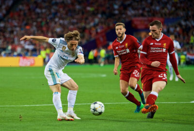 KIEV, UKRAINE - Saturday, May 26, 2018: Liverpool's Andy Robertson blocks a shot from Real Madrid's Luka Modrić during the UEFA Champions League Final match between Real Madrid CF and Liverpool FC at the NSC Olimpiyskiy.