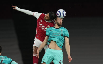 Liverpool's Nathaniel Phillips (R) challenges for a header with Arsenal's Pierre-Emerick Aubameyang during the FA Premier League match between Arsenal FC and Liverpool FC at the Emirates Stadium