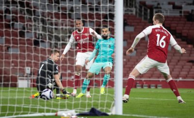 Liverpool's Mohamed Salah celebrates after scoring the second goal through the legs of Arsenal's goalkeeper Bernd Leno during the FA Premier League match between Arsenal FC and Liverpool FC at the Emirates Stadium