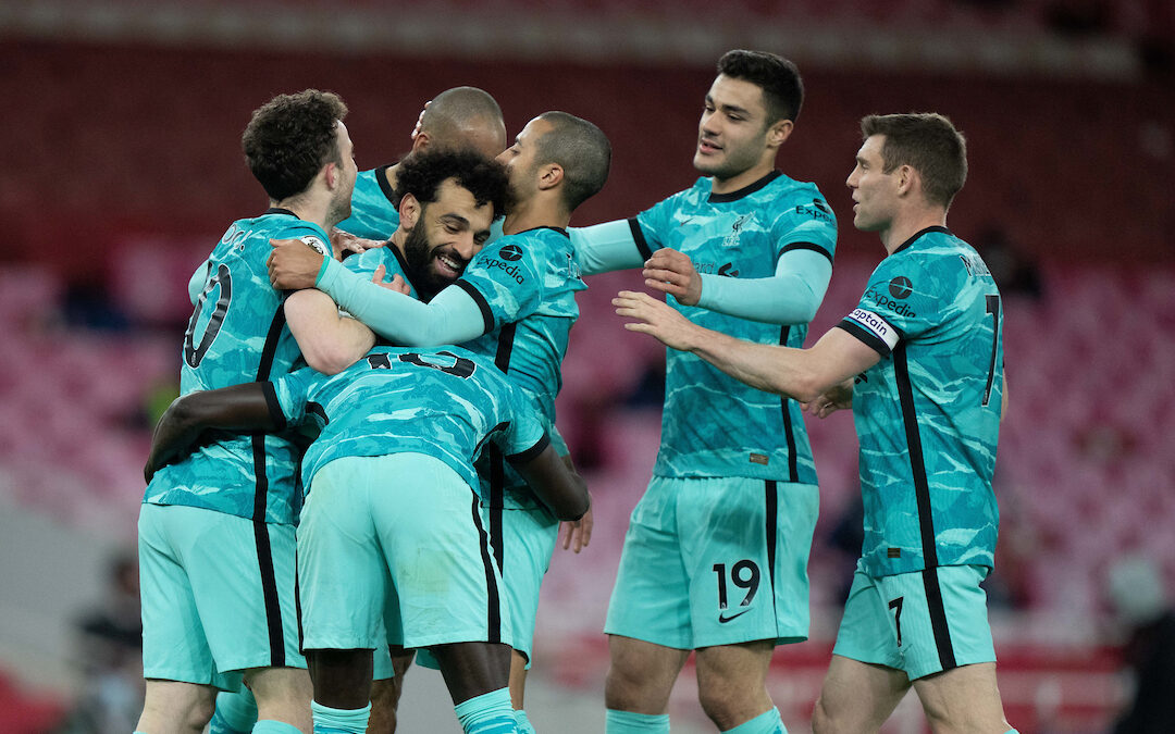 Liverpool's Mohamed Salah (C) celebrates after scoring the second goal during the FA Premier League match between Arsenal FC and Liverpool FC at the Emirates Stadium