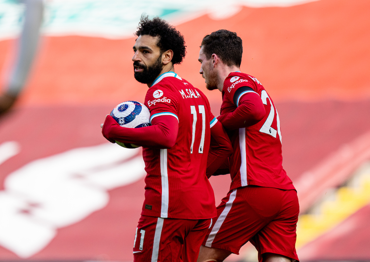 Liverpool's Mohamed Salah celebrates after scoring the first equalising goal during the FA Premier League match between Liverpool FC and Aston Villa FC at Anfield.