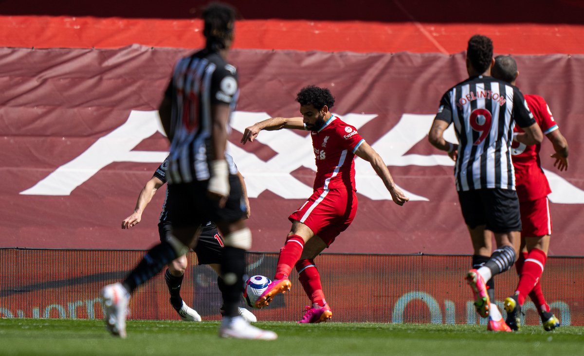 Liverpool's Mohamed Salah scores the first goal during the FA Premier League match between Liverpool FC and Newcastle United FC at Anfield.