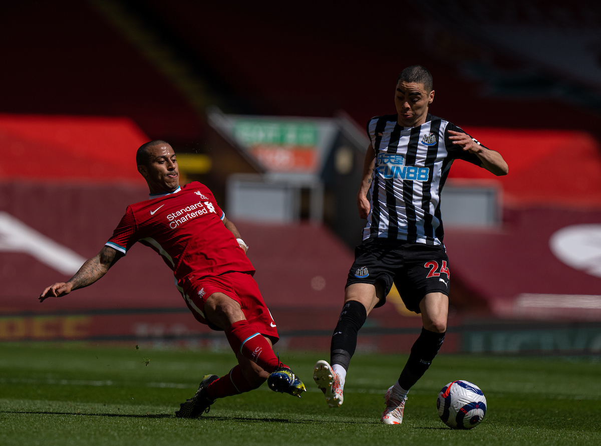Liverpool's Thiago Alcantara (L) tackles Newcastle United's Miguel Almirón during the FA Premier League match between Liverpool FC and Newcastle United FC at Anfield.