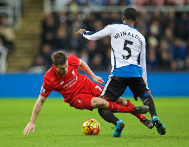 Liverpool's James Milner tackles Newcastle United's Gini Wijnaldum during the Premier League match at St. James' Park.