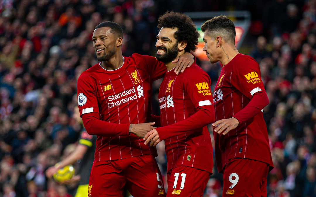 Liverpool's Mohamed Salah (C) celebrates scoring the third goal with team-mates Georginio Wijnaldum (L) and Roberto Firmino (R) during the FA Premier League match between Liverpool FC and Southampton FC at Anfield.