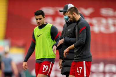 Liverpool's manager Jurgen Klopp chats with Ozan Kabak and Nat Phillips
