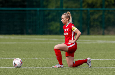 Liverpool's Kirsty Linnett kneels down (takes a knee) in support of the Black Lives Matter movement before the Women’s FA Cup 4th Round match between Leicester City FC Women and Liverpool FC Women at Farley Way Stadium.