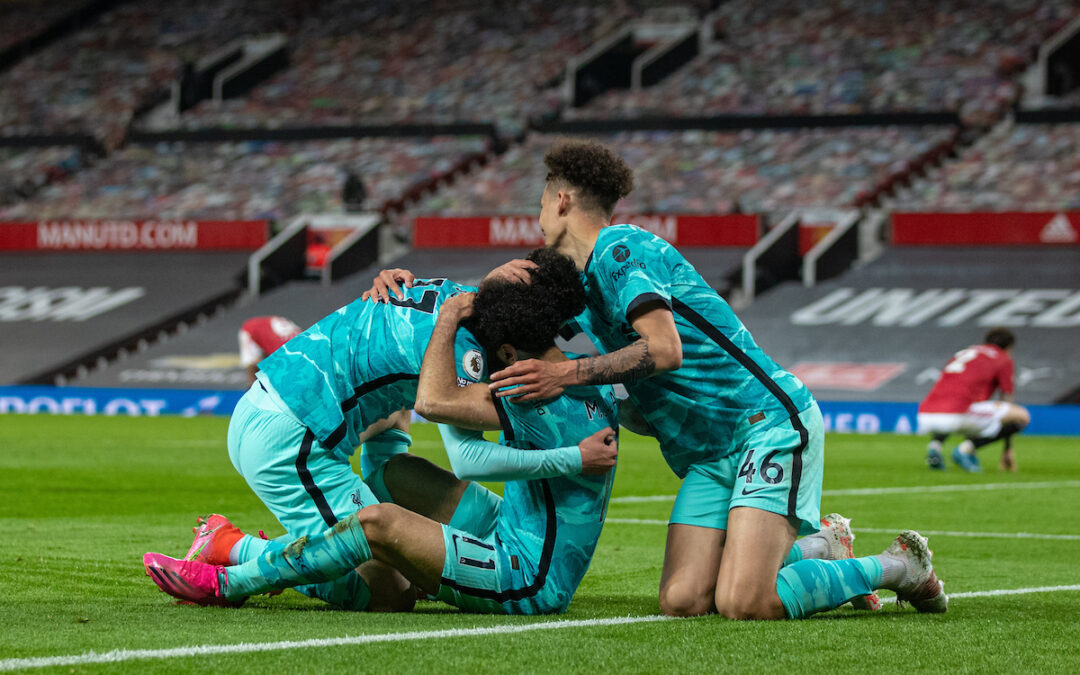 Liverpool's Mohamed Salah (C) celebrates with team-mates Curtis Jones (L) and Rhys Williams (R) after scoring the fourth goal during the FA Premier League match between Manchester United FC and Liverpool FC at Old Trafford.