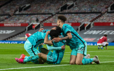 Liverpool's Mohamed Salah (C) celebrates with team-mates Curtis Jones (L) and Rhys Williams (R) after scoring the fourth goal during the FA Premier League match between Manchester United FC and Liverpool FC at Old Trafford.