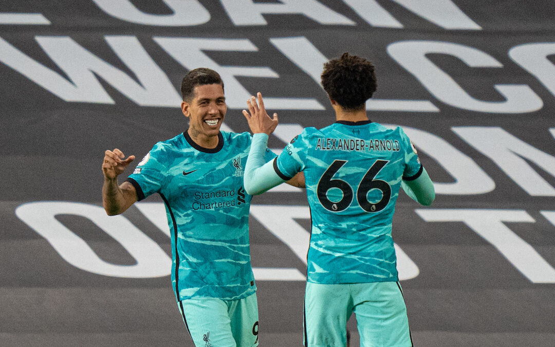 Liverpool's Roberto Firmino (L) celebrates with team-mate Trent Alexander-Arnold after scoring the second goal during the FA Premier League match between Manchester United FC and Liverpool FC at Old Trafford.