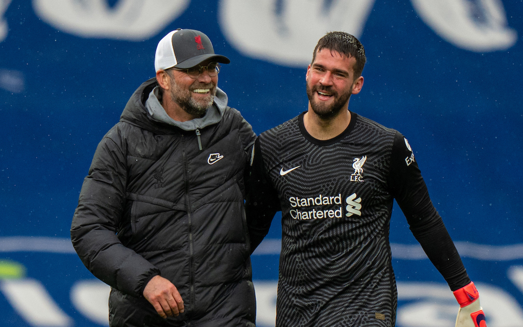 Liverpool's goalkeeper Alisson Becker celebrates with manager Jurgen Klopp after scoring the winning goal in injury time during the FA Premier League match against West Brom