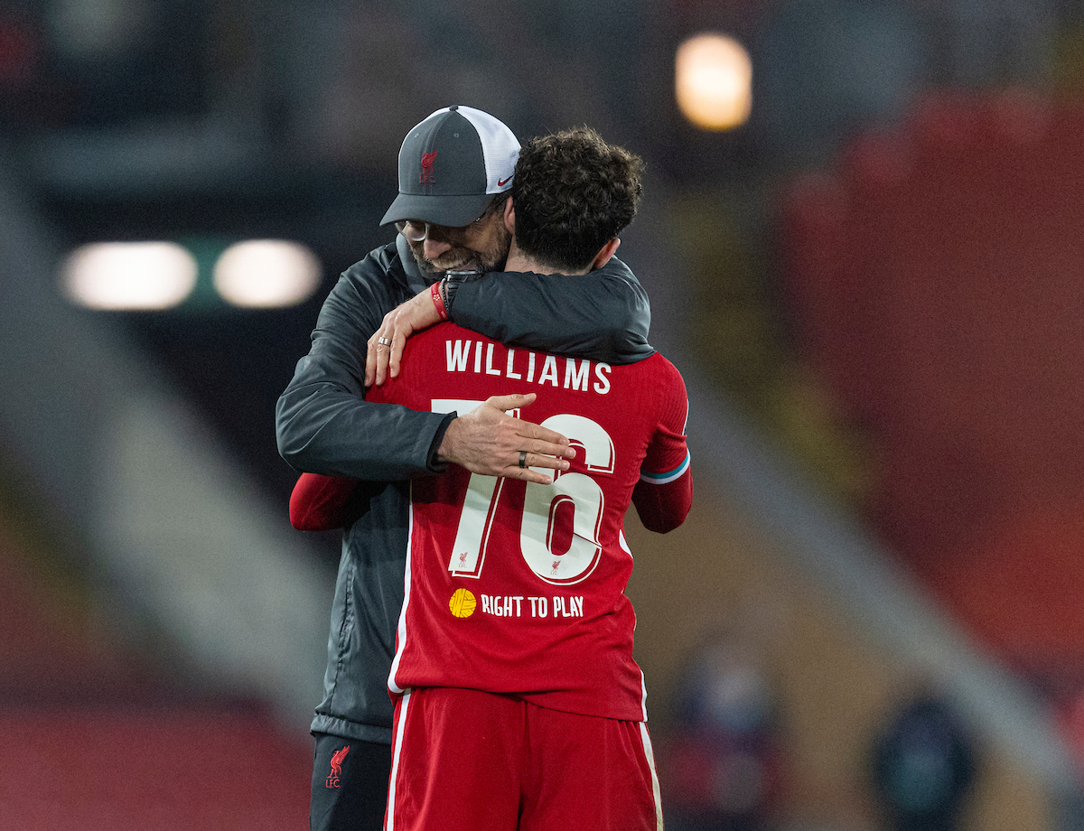 Neco Williams is embraced by Jurgen Klopp