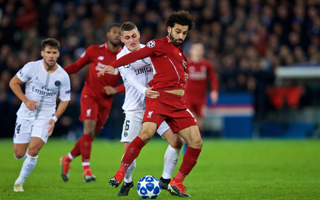 Mo Salah is pulled back by Paris Saint-Germain's Marco Verratti during the UEFA Champions League Group C match between Paris Saint-Germain and Liverpool FC at Parc des Princes.