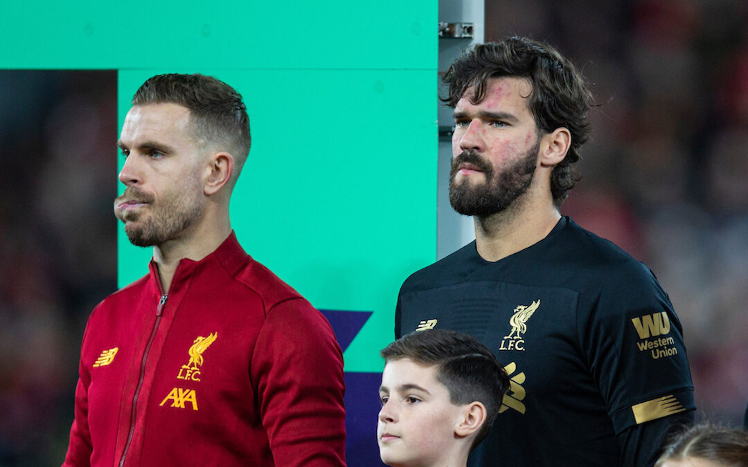 Jordan Henderson and Alisson Becker of Liverpool FC