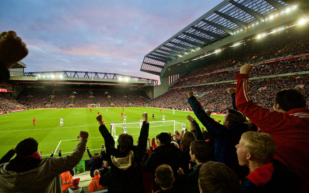 Liverpool supporters celebrate during a match at Anfield.