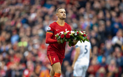 Liverpool's captain Jordan Henderson lays a wreath in memory of the past players who died during the Covid-19 pandemic during the FA Premier League match between Liverpool FC and Burnley FC at Anfield