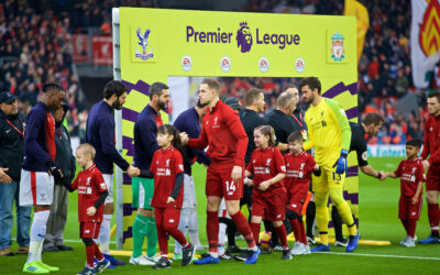 Liverpool's captain Jordan Henderson shakes hands with Crystal Palace's goalkeeper Julián Speroni before the FA Premier League match between Liverpool FC and Crystal Palace FC at Anfield