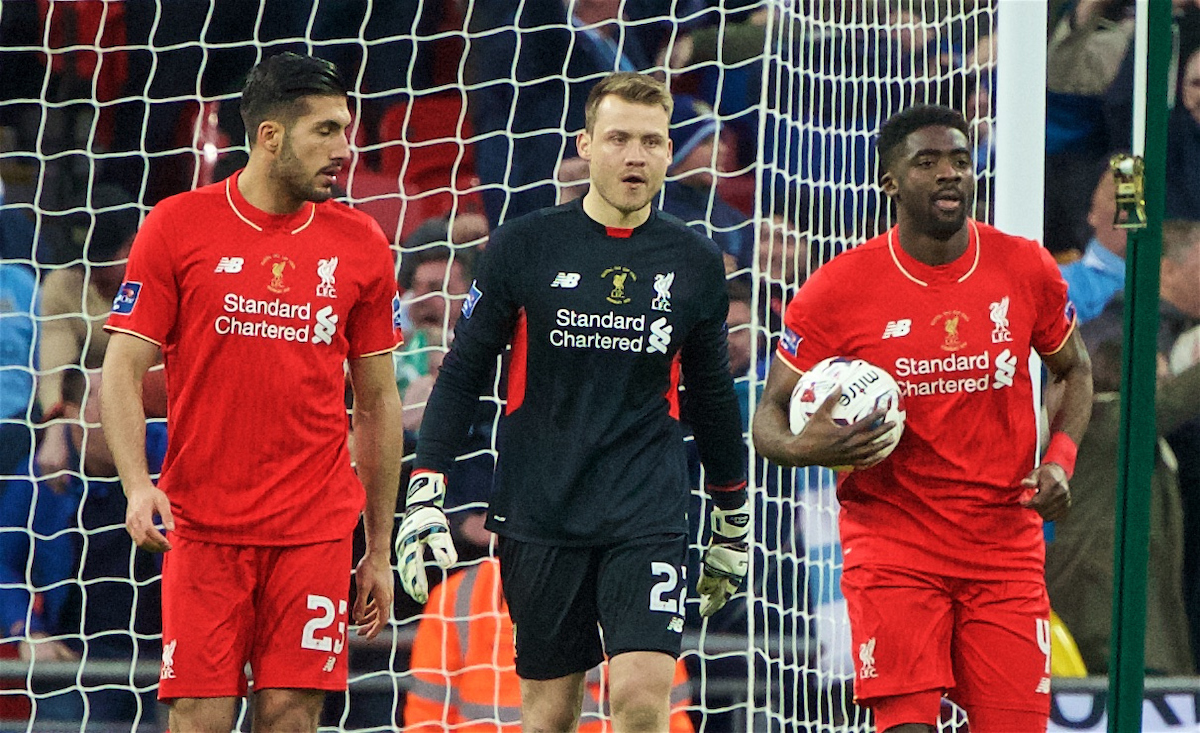 Liverpool's goalkeeper Simon Mignolet looks dejected as Manchester City score the opening goal during the Football League Cup Final match at Wembley Stadium