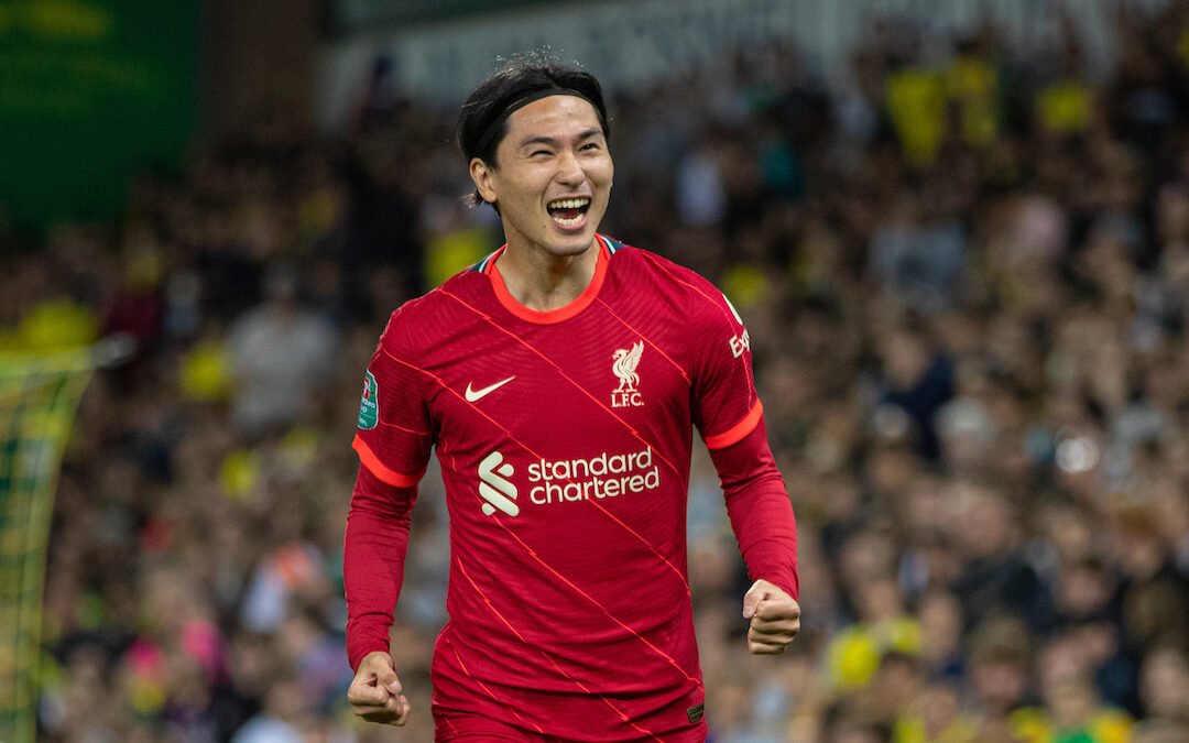 Liverpool's Takumi Minamino celebrates after scoring the first goal during the Football League Cup 3rd Round match between Norwich City FC and Liverpool FC at Carrow Road