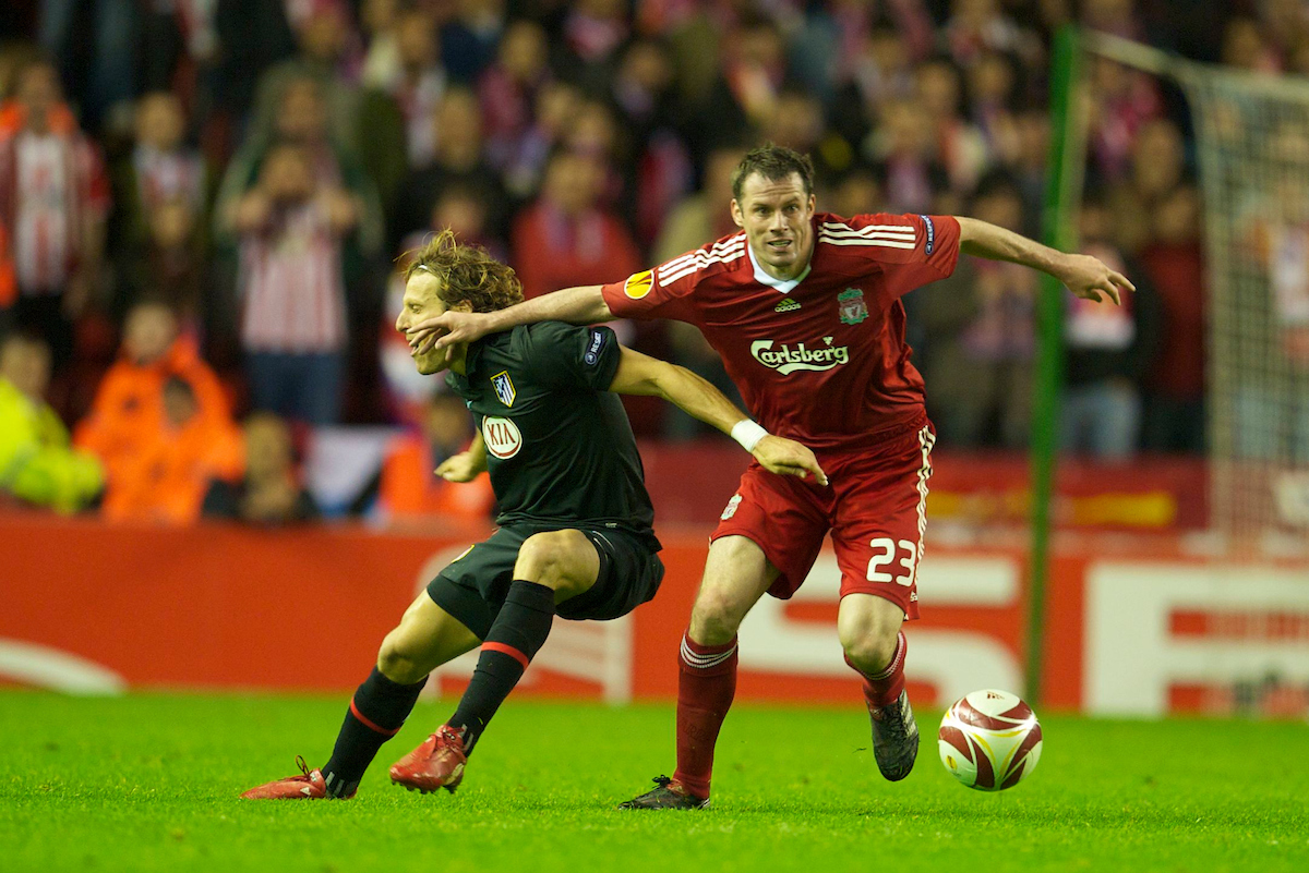 Liverpool's Jamie Carragher and Club Atletico de Madrid's Diego Forlan during the UEFA Europa League Semi-Final 2nd Leg match at Anfield.