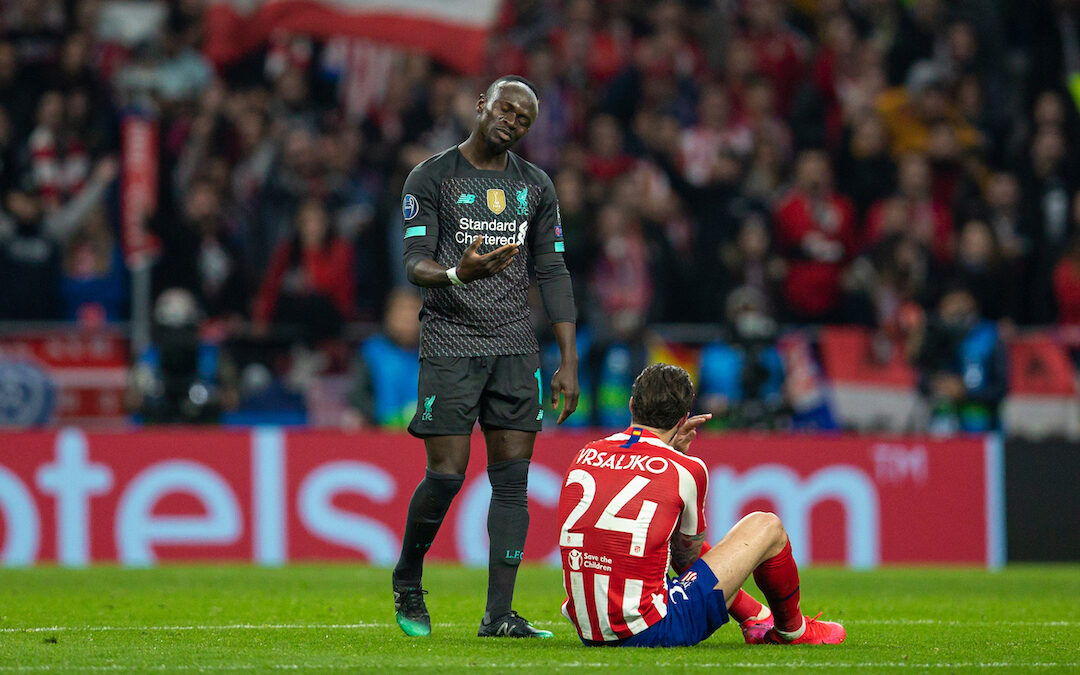 Liverpool's Sadio Mané asks Club Atlético de Madrid's Šime Vrsaljko to get up after he fell clutching his face following a challenge during the UEFA Champions League Round of 16 1st Leg match between Club Atlético de Madrid and Liverpool FC at the Estadio Metropolitano