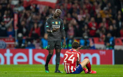 Liverpool's Sadio Mané asks Club Atlético de Madrid's Šime Vrsaljko to get up after he fell clutching his face following a challenge during the UEFA Champions League Round of 16 1st Leg match between Club Atlético de Madrid and Liverpool FC at the Estadio Metropolitano