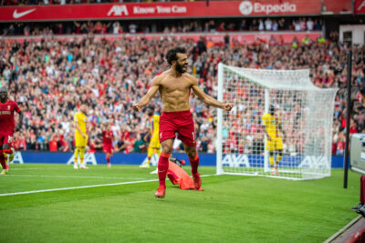 LIVERPOOL, ENGLAND - Saturday, September 18, 2021: Liverpool's Mohamed Salah pulls off his shirt as he celebrates after scoring the second goal, his 101st in the Premier League, during the FA Premier League match between Liverpool FC and Crystal Palace FC at Anfield. Liverpool won 3-0. (Pic by David Rawcliffe/Propaganda)