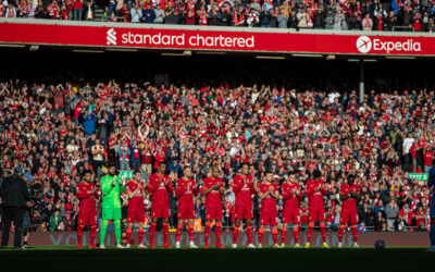 Liverpool players and supporters stand for a minute's applause to remember former player Roger Hunt who died earlier in the week before the FA Premier League match between Liverpool FC and Manchester City FC at Anfield.