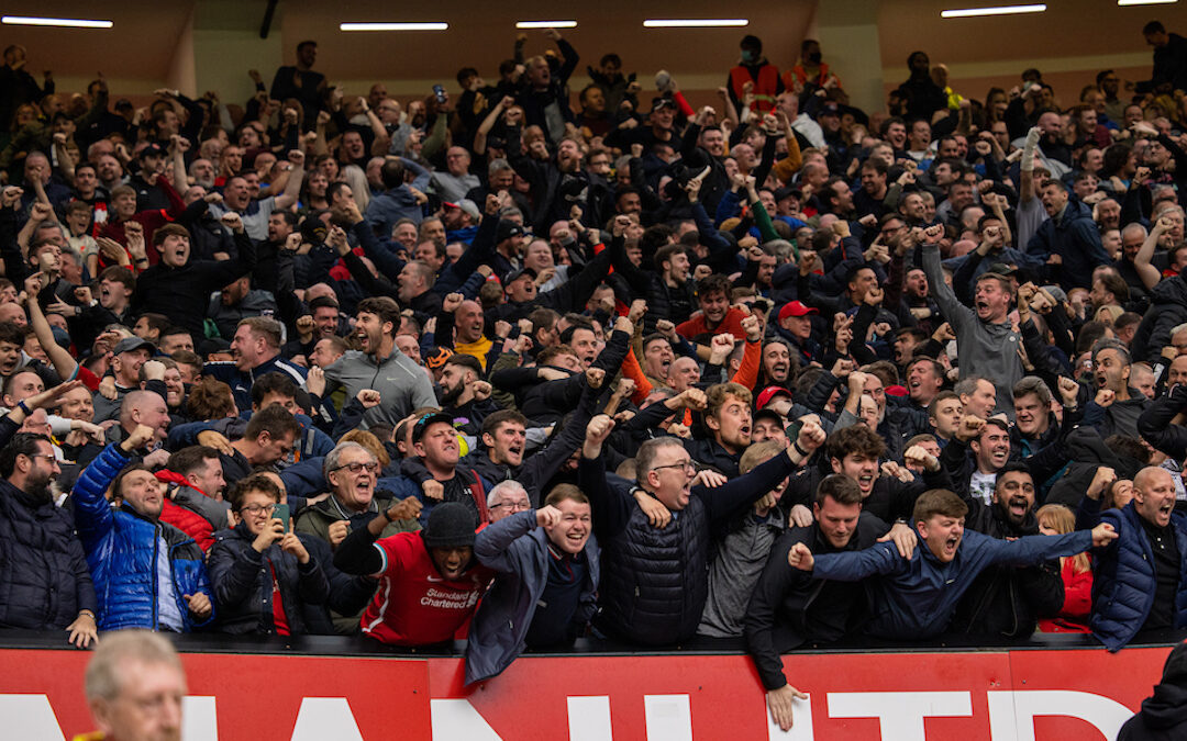 Liverpool supporters celebrate their side's opening goal during the FA Premier League match between Manchester United FC and Liverpool FC at Old Trafford