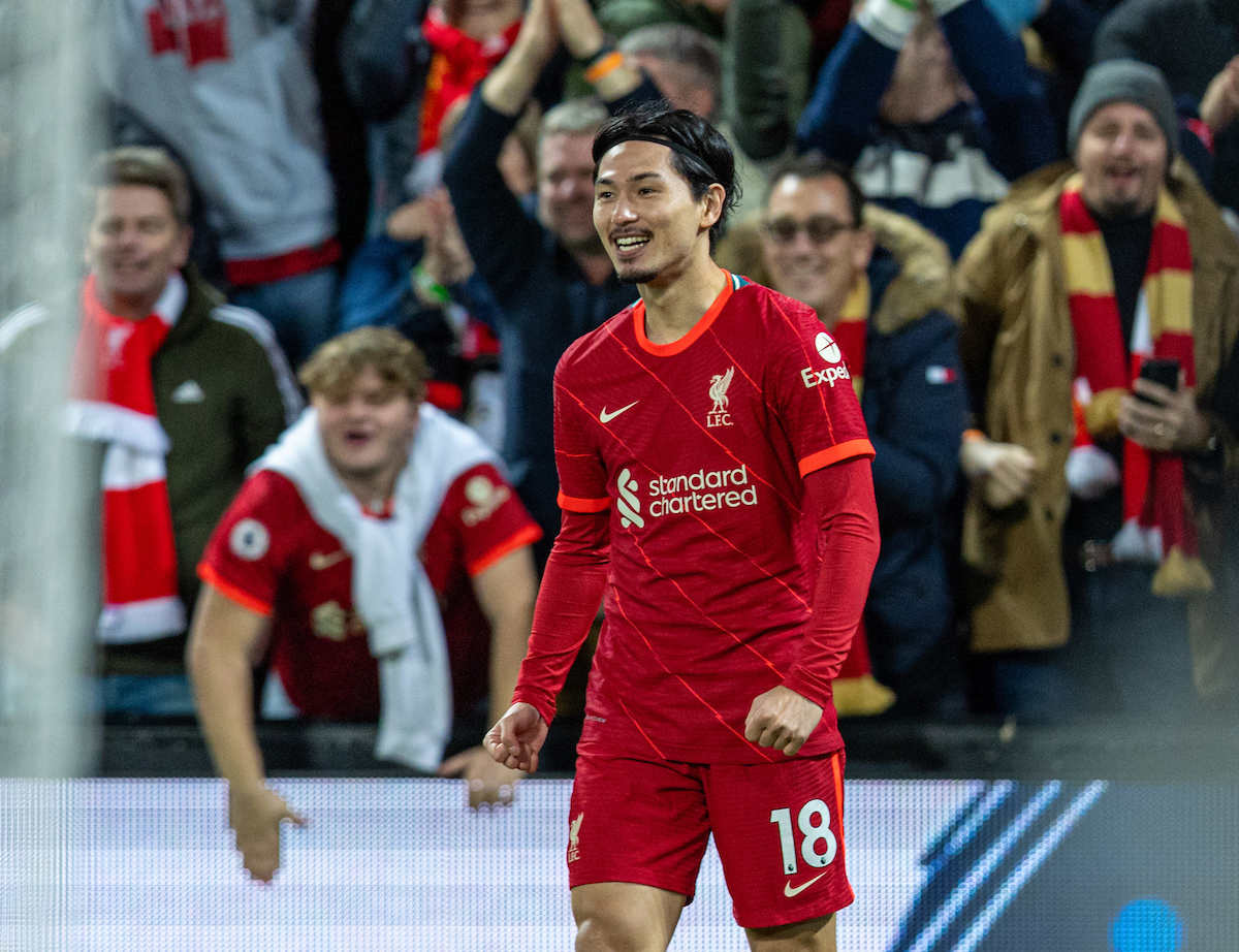 Liverpool's Takumi Minamino celebrates after scoring the fourth goal during the FA Premier League match between Liverpool FC and Arsenal FC at Anfield