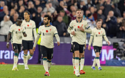 Liverpool's Mohamed Salah (L) and captain Jordan Henderson look dejected as West Ham United score the third goal during the FA Premier League match between West Ham United FC and Liverpool FC at the London Stadium