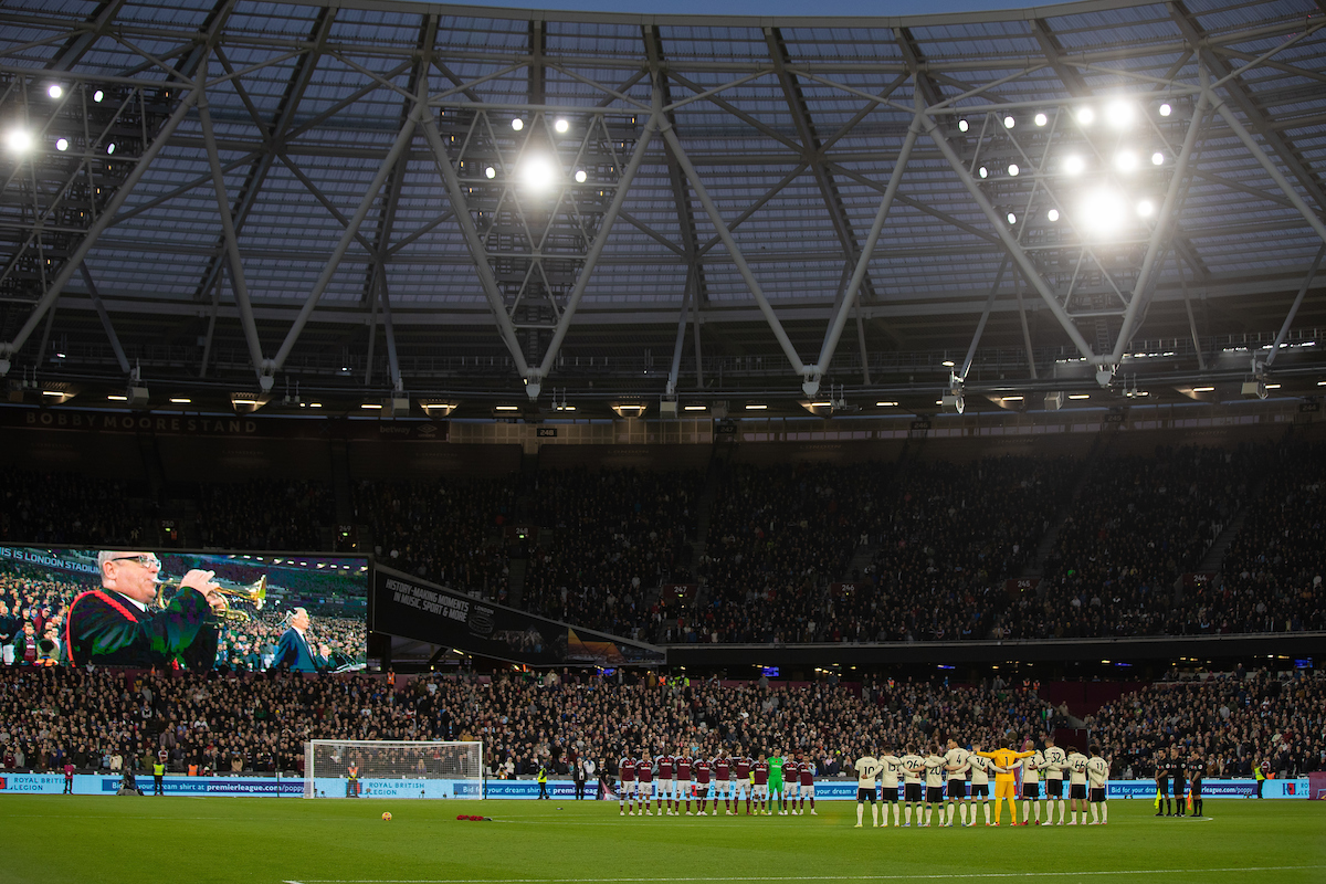 Liverpool players stand for a minute's silence before the FA Premier League match between West Ham United FC and Liverpool FC at the London Stadium