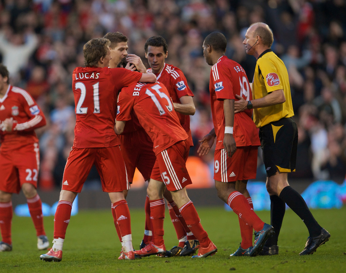 Liverpool's match-winner Yossi Benayoun (hidden) is mobbed as he celebrates his goal with team-mates against Fulham during the Premiership match at Craven Cottage
