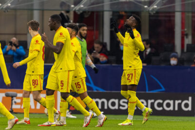 Liverpool's Divock Origi (R) celebrates after scoring the winning second goal during the UEFA Champions League Group B Matchday 6 game between AC Milan and Liverpool FC at the Stadio San Siro