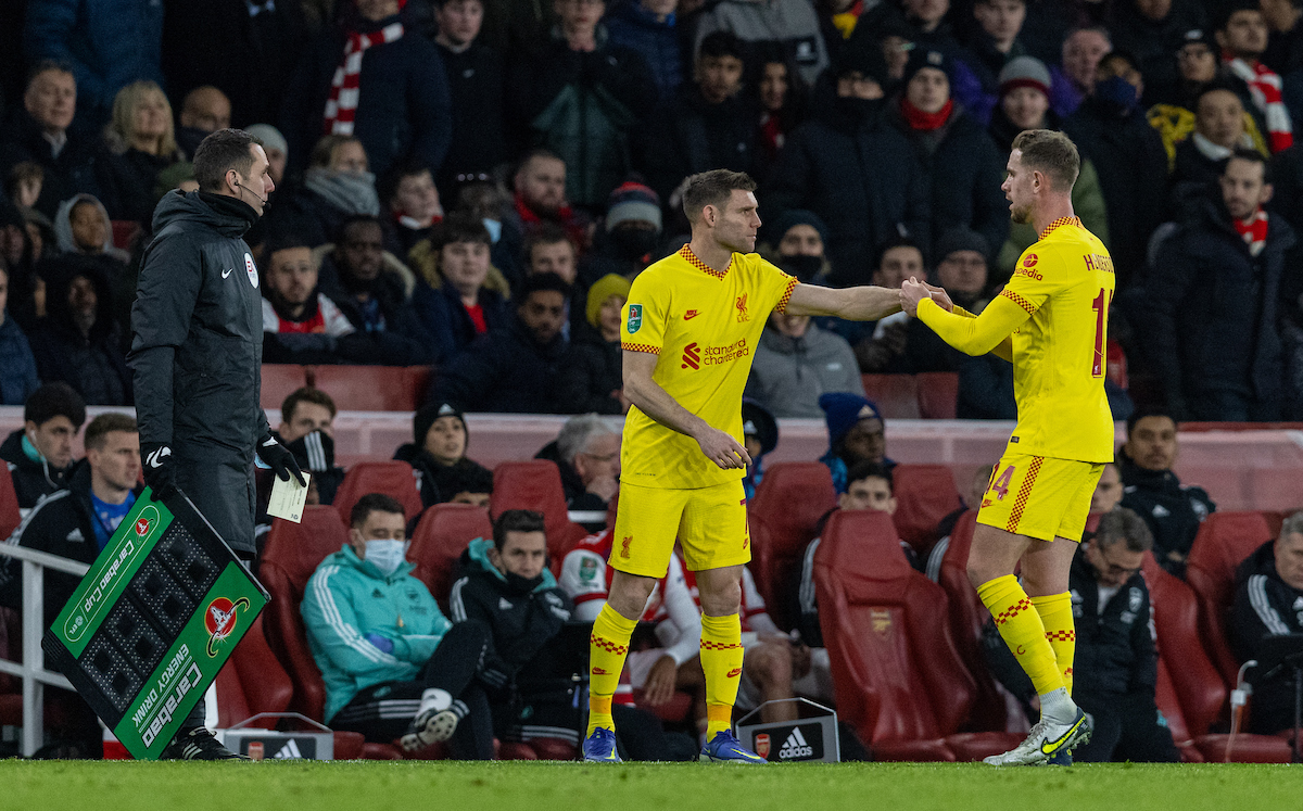 Liverpool's captain Jordan Henderson hands the captain's armband to James Milner as he is substituted during the Football League Cup Semi-Final 2nd Leg match between Arsenal FC and Liverpool FC at the Emirates Stadium