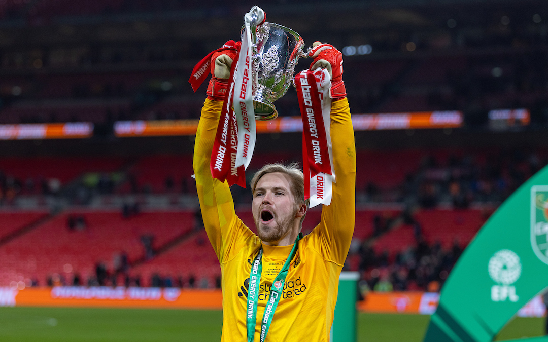 Liverpool's Caoimhin Kelleher, who scored the decisive last penalty kick of the shoot out, celebrates with the trophy after winning the Football League Cup Final match between Chelsea FC and Liverpool FC at Wembley Stadium